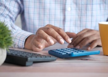 accountant using calculator